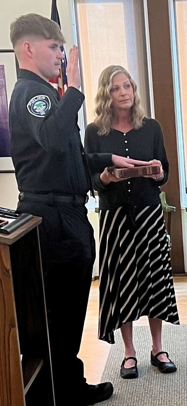 Officer Sluder being sworn in.